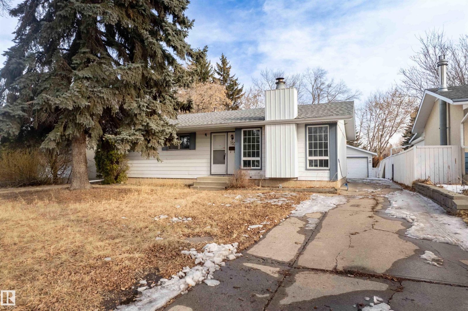 Front exterior of the Sherwood Park home before renovation